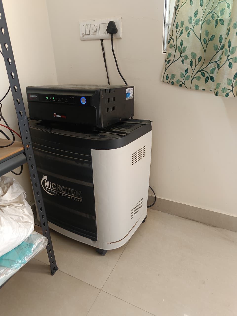 Microtek Heavy Duty inverter with tall tubular battery installation in a Hyderabad home by Satyajan Energy Solutions.